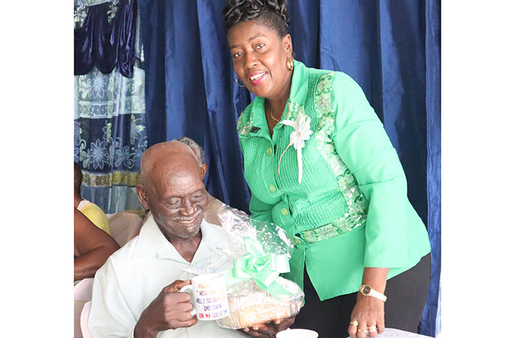 One of the 10 elderly persons who were honoured by Minister within the Ministry of Agriculture Valerie Adams-Yearwood