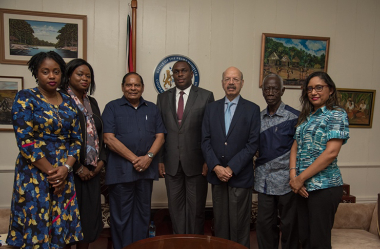 Standing from left to right are: Head of Good Offices for Peace Governance, Dr. Tres-Ann Kremer; the Prime Minister’s Legal Adviser on Governance, Tamara Khan; Prime Minister Moses Nagamootoo; former Chairman of the Ghana Elections Commission, Dr. Kwadwo Afari-Gyan; former Chief Elections Commissioner of India, Dr Nasim Zaidi; Adviser and Head of Elections Support, Mr Martin Kasirye and Head of Information Technology Policy and Special Projects, Deeann Ali. (DPI photo)
