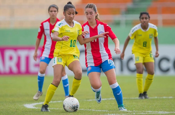 Guyana’s Kiana Khedoo (#10) battles Puerto Rico’s Zoemi Cobián during the Lady Jags’ 2–1 win in the CONCACAF U-20 Women’s Championship, in Santo Domingo, Dominican Republic. (Photo compliments: Mexport/CONCACAF