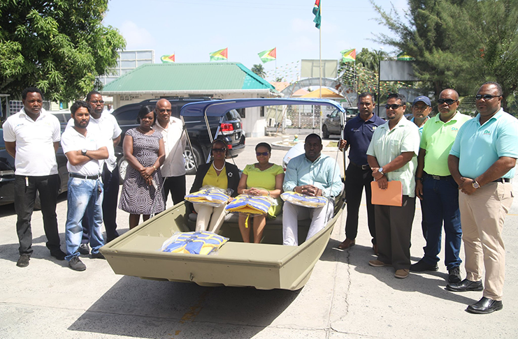 Minister of Public Health, Volda Lawernce (center) sits in the boat along with other representatives from the Ministry. (DPI photo)