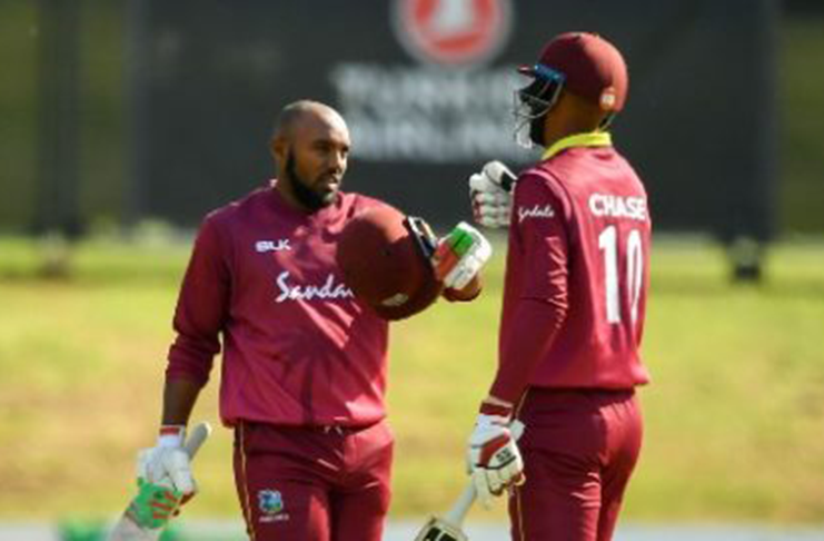 Roston Chase (right) and Sunil Ambris partnered in a century-stand for West Indies.
