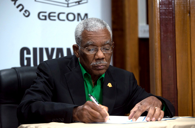 President David Granger of the A Partnership for National Unity + Alliance For Change (APNU+AFC) places his signature to the code of conduct established by the Guyana Elections Commission (GECOM)