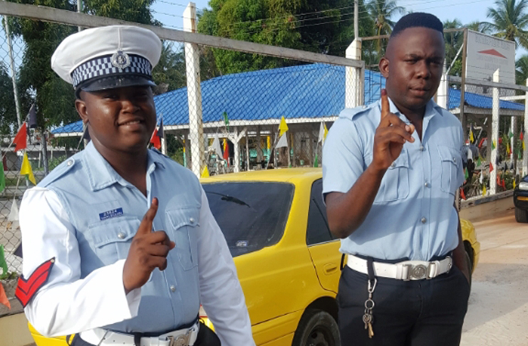Two policemen from the Suddie Police Station who voted