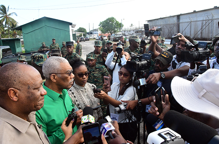 President David Granger responding to questions being posed by media operatives during his visit to GDF’s Base Camp Ayanganna on Friday. He was accompanied by Director-General of the Ministry of the Presidency, Joseph Harmon