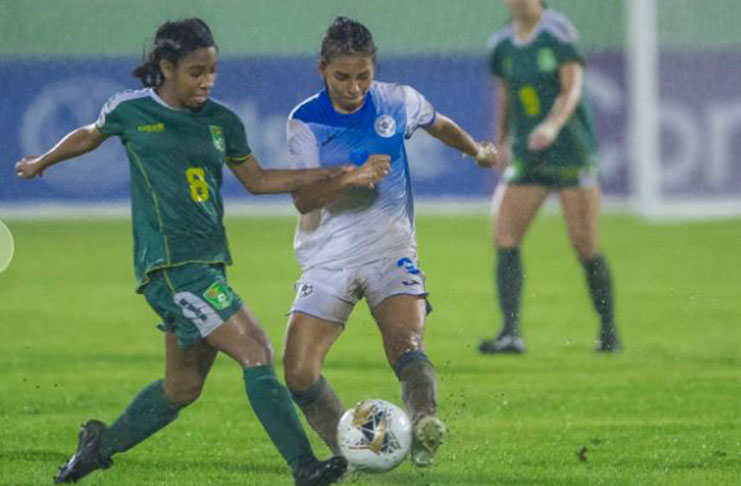 Goal scorer, Serena McDonald, battles Nicaragua’s Lesbeth Moreno in the midfield, during Guyana’s 3 – 1 win in the CONCACAF U-20 Women’s Championship. (Photo compliments of CONCACAF)