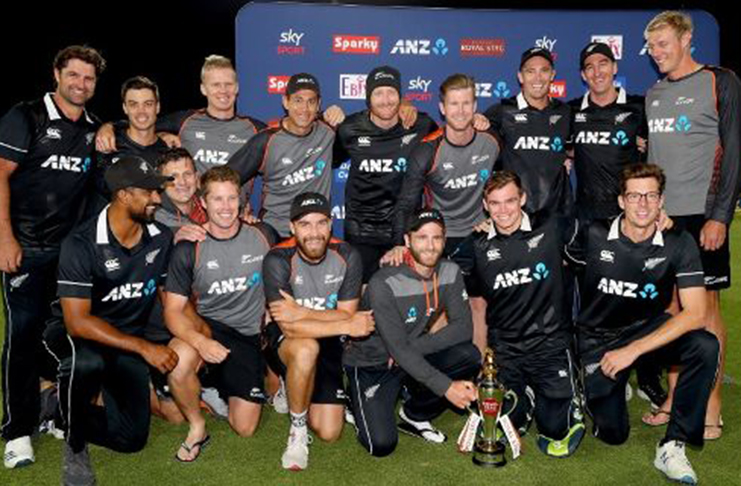 The New Zealand players pose with the trophy. (Getty Images)