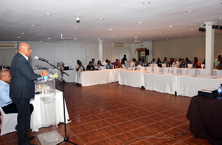 Minister of Natural Resources, Raphael Trotman, addressing miners at the opening ceremony of the mining symposium
