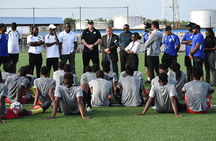 Minister Dr George Norton addresses the combined senior men's national team and the U-20 squad.