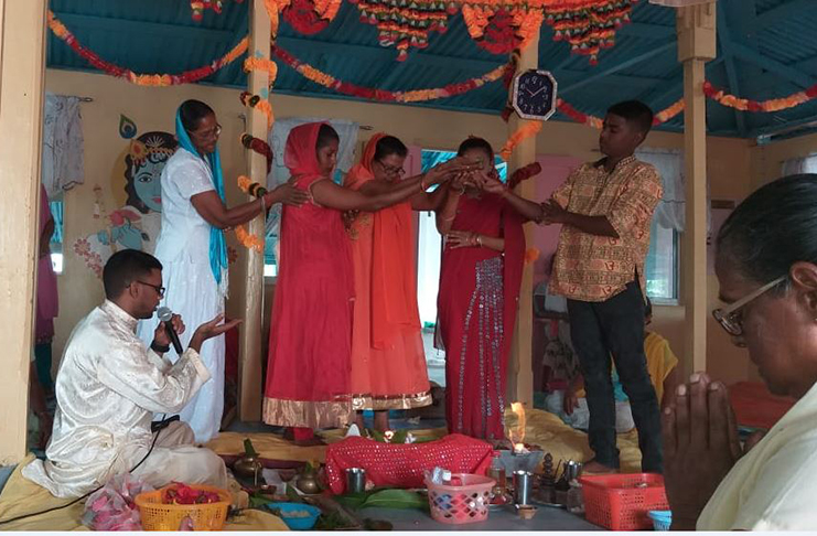 Persons from the Golden Fleece Vishwa Jhotir Mandir performing Shivratri puja