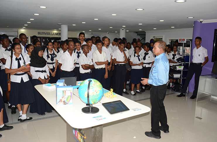 President of STARR Computer, Mike Mohan, in discussion with Berbice High School students