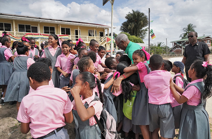Bartica schoolchildren were elated to
meet President David Granger as he
entered the township for the APNU+AFC
coalition’s campaign rally on Friday
(photo by APNU+AFC)
