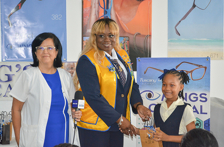 Dr. Michele Ming-- Optometrist – Ming’s Optical, Ms. Simone Beckles, President, Georgetown Durban Park Lions and pupils from the Tucville Primary School