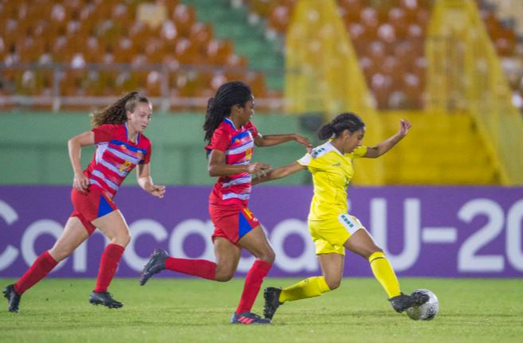 Action between Guyana and the Cayman Islands in the round-of-16 of the CONCACAF U-20 Women’s Championship.