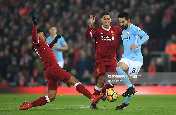 Ilkay Gundogan of Manchester City, Roberto Firmino of Liverpool and Alex Oxlade-Chamberlain of Liverpool in action during the Premier League match between Liverpool and Manchester City at Anfield on January 14, 2018 in Liverpool, England. (Photo by Shaun Botterill/Getty Images)