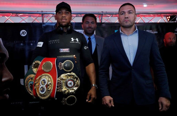 FILE PHOTO: Boxing - Anthony Joshua and Kubrat Pulev Press Conference - Cardiff, Britain - September 11, 2017 Anthony Joshua and Kubrat Pulev pose with promoter Eddie Hearn during the press conference Action Images via Reuters/Andrew Couldridge/File Photo