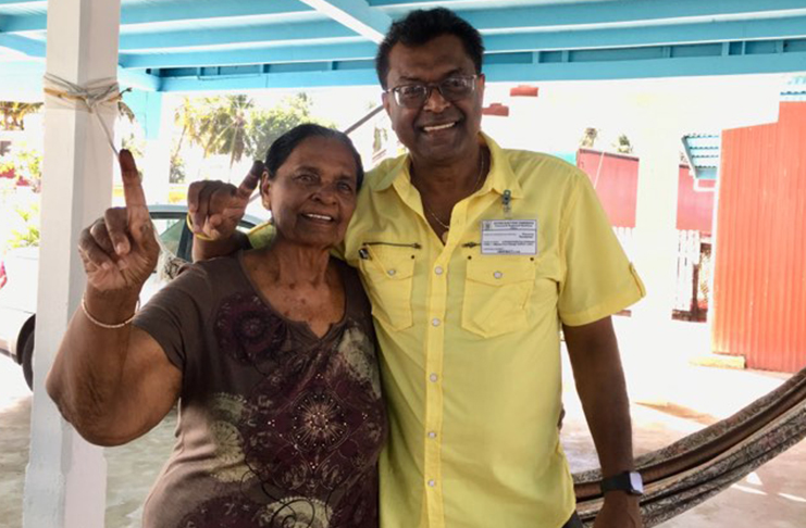 Minister of Public Security Khemraj Ramjattan with his mother Roshnie Ramjattan at his hometown in Number 47 Village