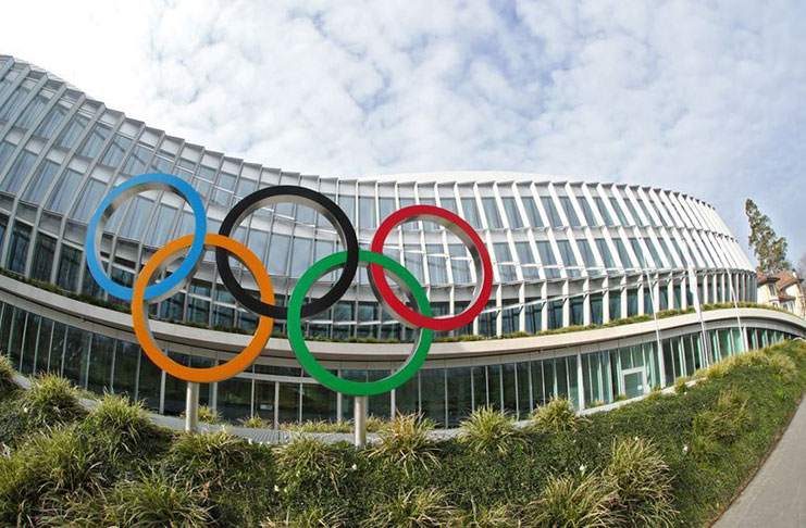 The Olympic rings are pictured in front of the International Olympic Committee (IOC) in Lausanne, Switzerland, yesterday. Picture was taken with a fisheye lens. (REUTERS/Denis Balibouse)