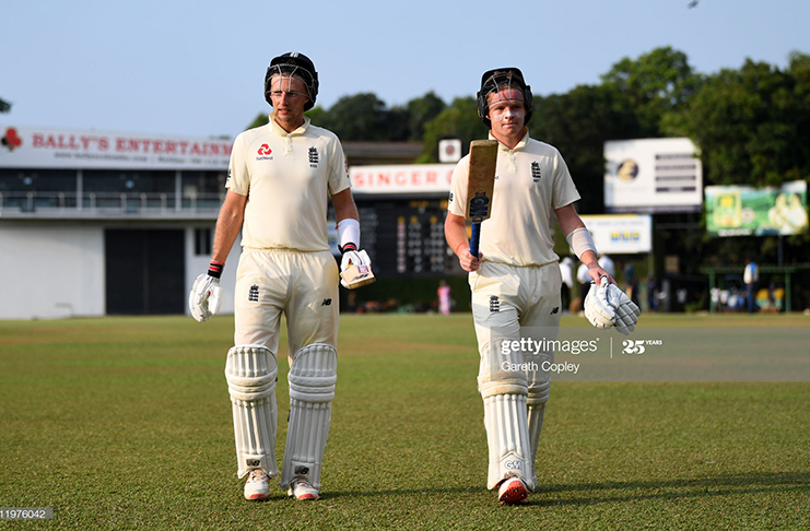 England captain Joe Root and Ollie Pope leave the field at stumps on day one of the tour match between SLC Board President's XI and England at P Sara Oval on March 12, 2020 in Colombo, Sri Lanka. (Photo by Gareth Copley/Getty Images)