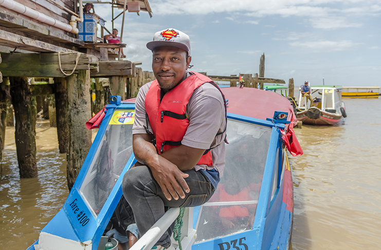 Andy Moffett, a boat operator who plies the Georgetown to Vreed-en-Hoop route