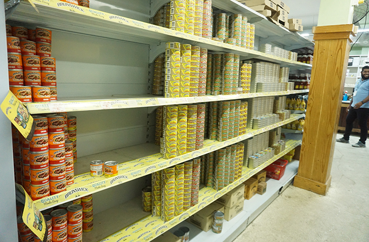 In this supermarket, canned products are rapidly disappearing off the shelves (Photos by Elvin Croker)