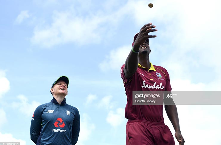 FLASHBACK! West Indies captain Jason Holder tosses the coin alongside England captain Eoin Morgan ahead the fifth One-Day International match between England and West Indies at Darren Sammy Cricket Ground on March 2, 2019 in Gros Islet, St Lucia. (Photo by Gareth Copley/Getty Images,)