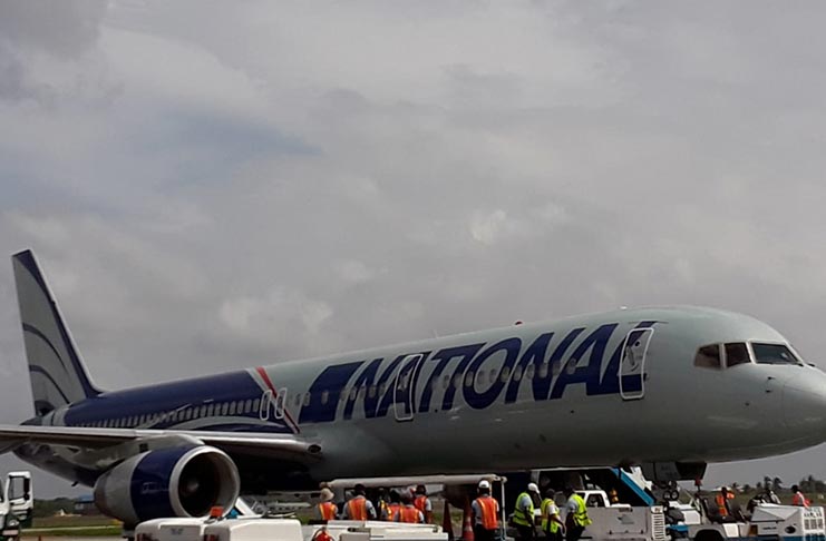 The National Airline flight which transported Exxon Mobil employees to Texas, on the tarmac at the Cheddi Jagan International Airport, Timehri