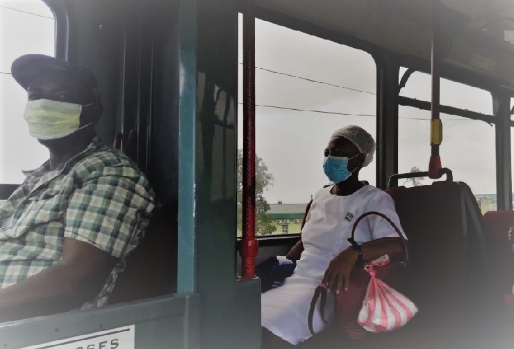 A nurse sits comfortably is the driver prepares to drop her and her colleagues home earlier today.