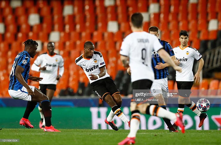 Geoffrey Kondogbia of Valencia passes the ball during the UEFA Champions League round of 16 second leg match between Valencia CF and Atalanta at Estadio Mestalla on March 10, 2020 in Valencia, Spain. (Photo by UEFA - Handout via Getty Images)
