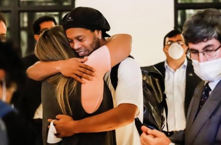 Ronaldinho was met by friends at the hotel in Asuncion where he must now stay.