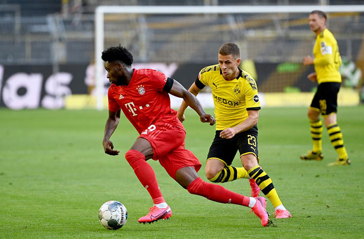 Signal Iduna Park, Dortmund, Germany - Bayern Munich's Alphonso Davies in action with Borussia Dortmund's Thorgan Hazard, as play resumes behind closed doors following the outbreak of the coronavirus disease (COVID-19) Federico Gambarini/Pool via REUTERS