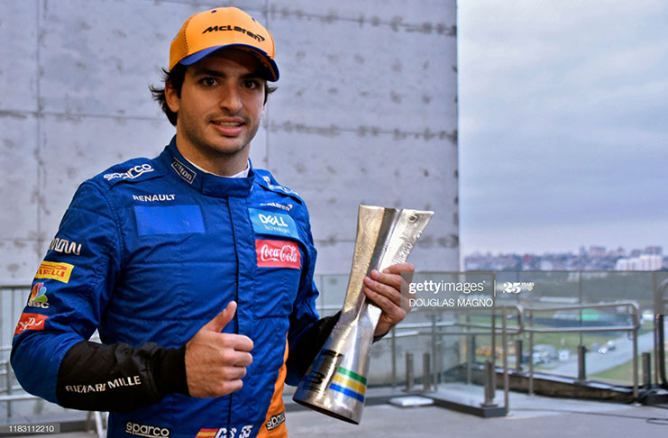 McLaren's Spanish driver Carlos Sainz Jr celebrates his thrid place at the end of the F1 Brazil Grand Prix, at the Interlagos racetrack in Sao Paulo, Brazil on November 17, 2019. (Photo by DOUGLAS MAGNO/AFP via Getty Images)