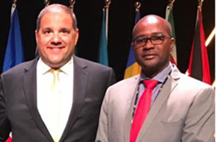 GFF president Wayne Forde (right) and Victor Montagliani, president of CONCACAF