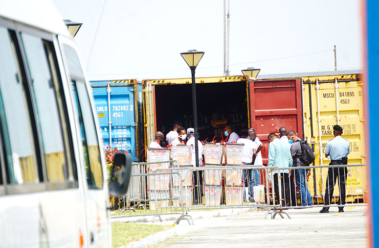 Ballot boxes being removed from one of the containers (Elvin Croker Photo)
