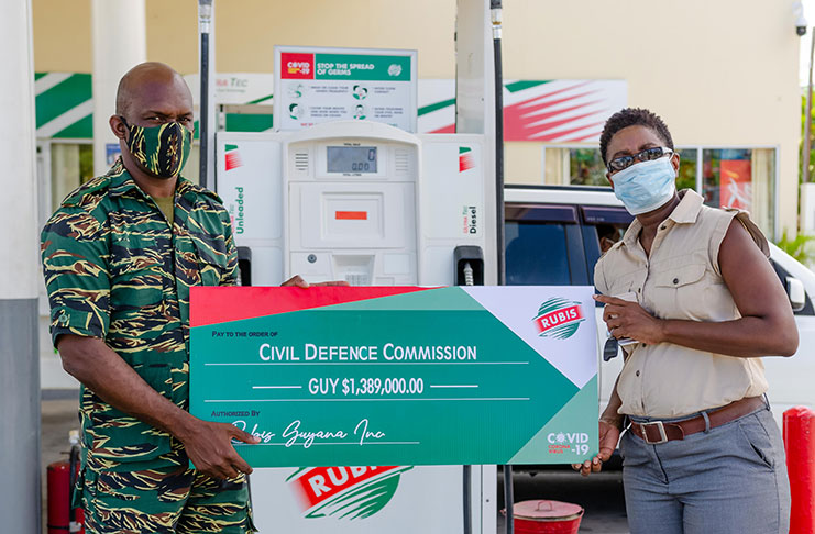 Joylyn Johnson, Retail Account Executive, Rubis Guyana, making the presentation to Brigadier (ret’d) George A. Lewis, Chief Executive Officer of the Georgetown Public Hospital Corporation