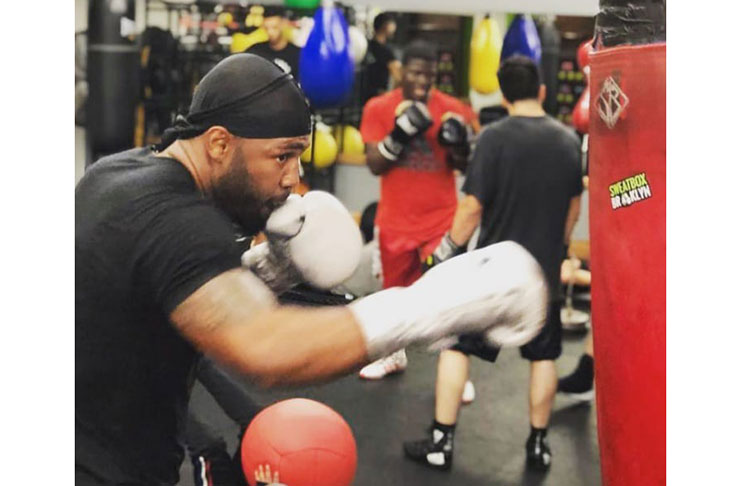 Guyana's Lennox 'Too Sharp' Allen punches the bag during training.