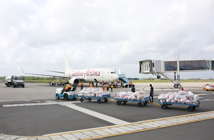 The care packages for Guyanese students in Cuba being loaded onto the Caribbean Airlines flight