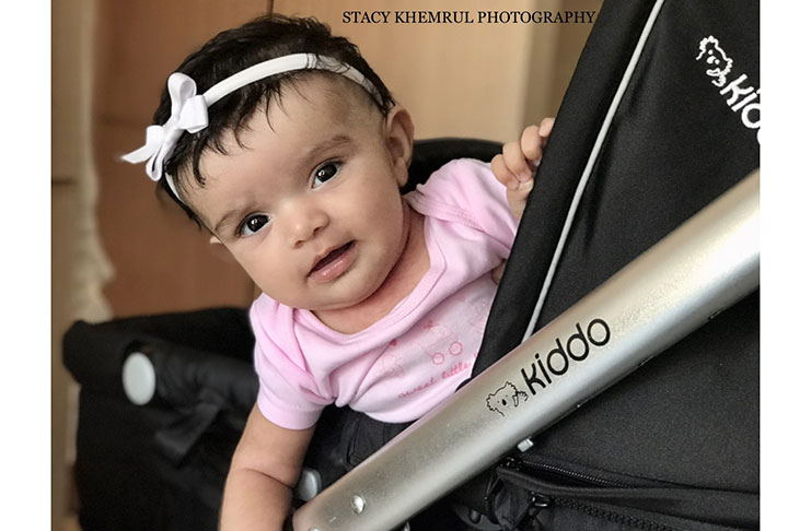 Two-month old Savannah-Rose smiles for her mummy Stacy Khemrul from her stroller in Brasilia. She is now an Instagram baby with more than 500 followers.