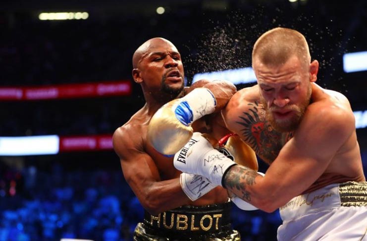 Floyd Mayweather (at left) has sent a warning to Conor McGregor while reacting to his shock retirement.