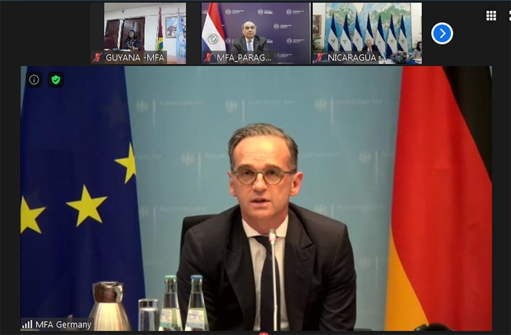 German Foreign Minister, Mr. Heiko Maas, ( at centre ) engages his counterparts in a discussion on COVID-19. Also pictured are Minister Cummings (top left); Paraguayan Foreign Minister, Mr. Antonio Rivas Palacios (top center); and Nicaraguan Minister for National Policy, Mr. Paul Oquist Kelly (top right)