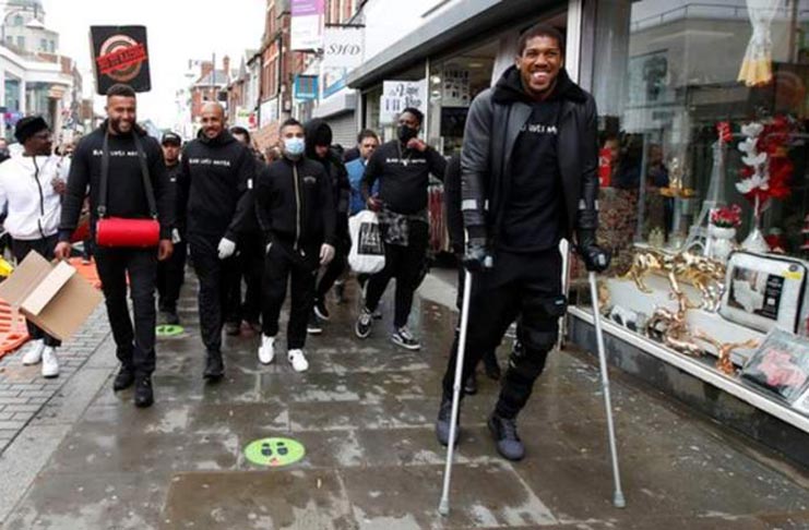 Anthony Joshua was also seen using crutches.