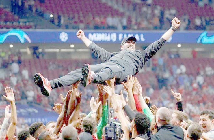 Liverpool manager Juergen Klopp is thrown in the air by the players as they celebrate after winning the Champions League Final v Tottenham Hotspur at Wanda Metropolitano, Madrid, Spain, June 1, 2019. (REUTERS/Kai Pfaffenbach/file photo)
