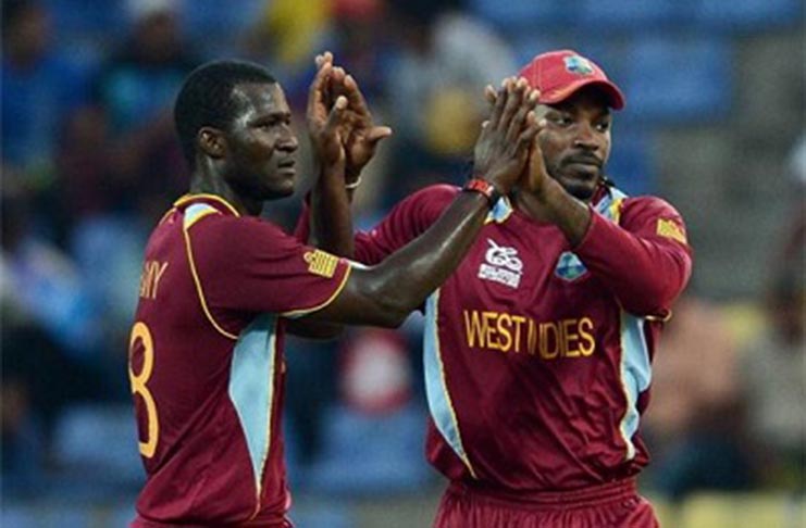 Darren Sammy (left) and Chris Gayle when they played together for the West Indies.