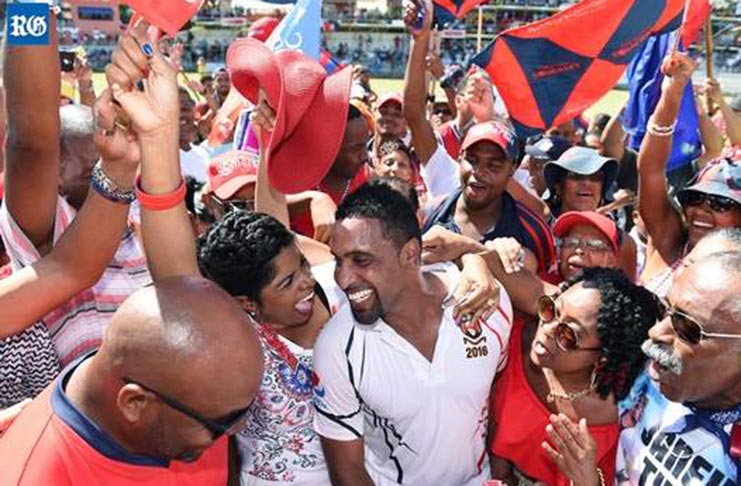 Swarming uncertainties: scenes such as this, which greeted Janeiro Tucker when he scored a century in his final Cup Match in 2016, will have informed decision-making on the cancellation of the premier sporting and cultural event on the Bermuda calendar as a result of the Covid-19 pandemic (Photograph by Akil Simmons). Photo extracted from The Royal Gazette.