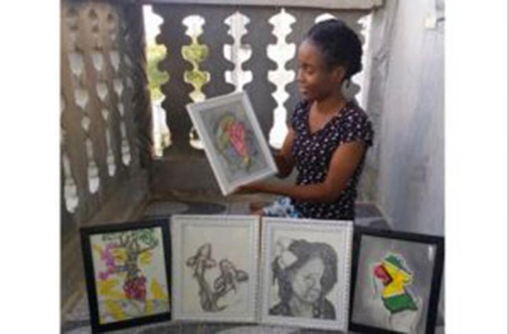 19-year-old Roxanne Austin with some of her artwork