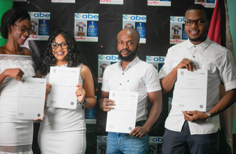 Four of the seven Barticans who completed their Level 4 foundation in Business management. From left: Noleen Charles, Ameena Rahaman, Jermaine Joseph and Akeem Prowell.