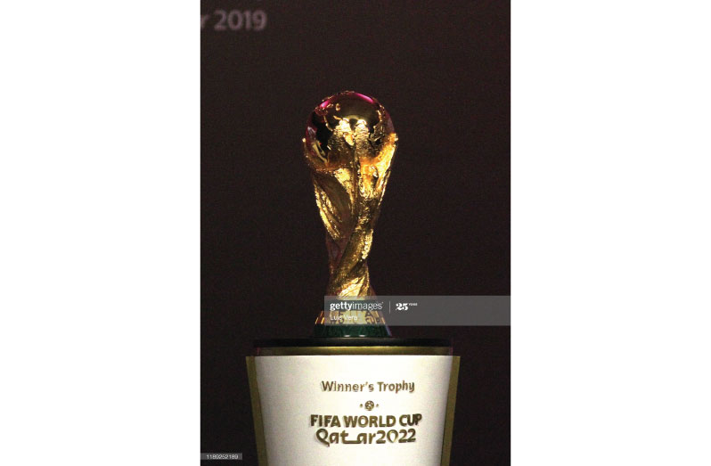 The FIFA World Cup trophy is displayed during the draw of the South American Qualifiers for Qatar 2022 at Centro de Convenciones de CONMEBOL on December 17, 2019 in Asuncion, Paraguay. (Photo by Luis Vera/Getty Images)