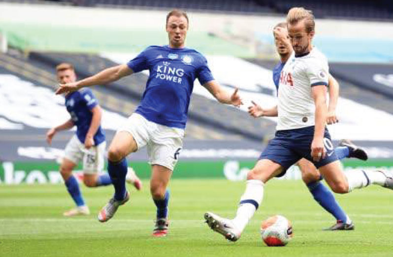 Tottenham Hotspur's English striker Harry Kane scores his team's second goal during the English Premier League football match between Tottenham Hotspur and Leicester City at Tottenham Hotspur Stadium in London, yesterday. (Photos: AFP).