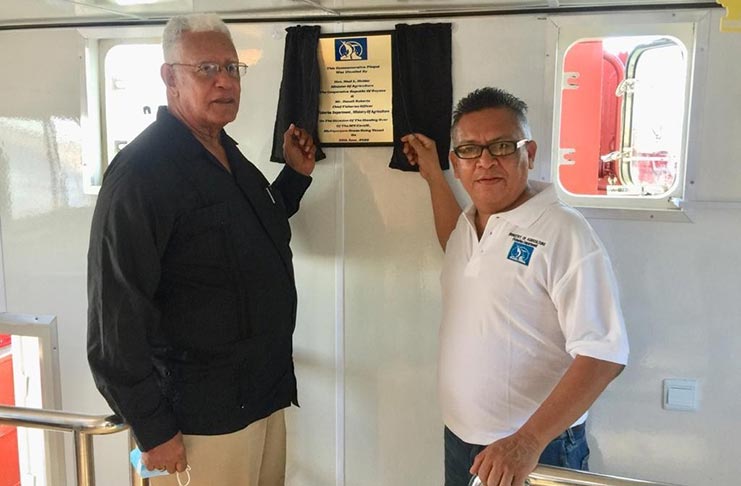 Minister Holder, alongside Chief Fisheries Officer, Denzil Roberts, as they unveiled the plaque at the commissioning on Tuesday