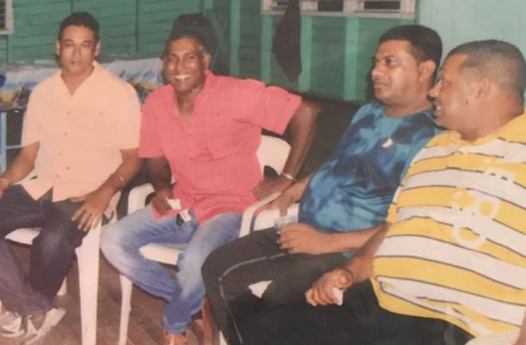 Anil Persaud (left) and Seemangal Yadram (2nd left) with other members of the Enterprise Legends side at a team function.