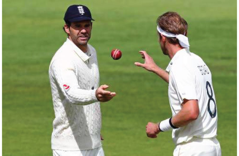 England's James Anderson (left) throws the ball to Stuart Broad on the final day of the third Test cricket match yesterday.